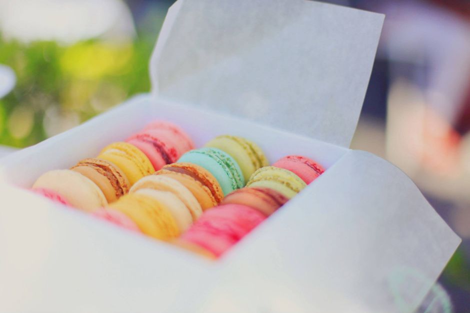 A colorful assortment of French macarons, an invitation to explore Paris through its pastries and flavors